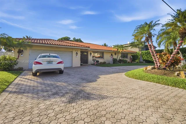 a car parked in front of a house
