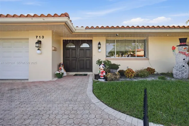 a front view of a house having yard