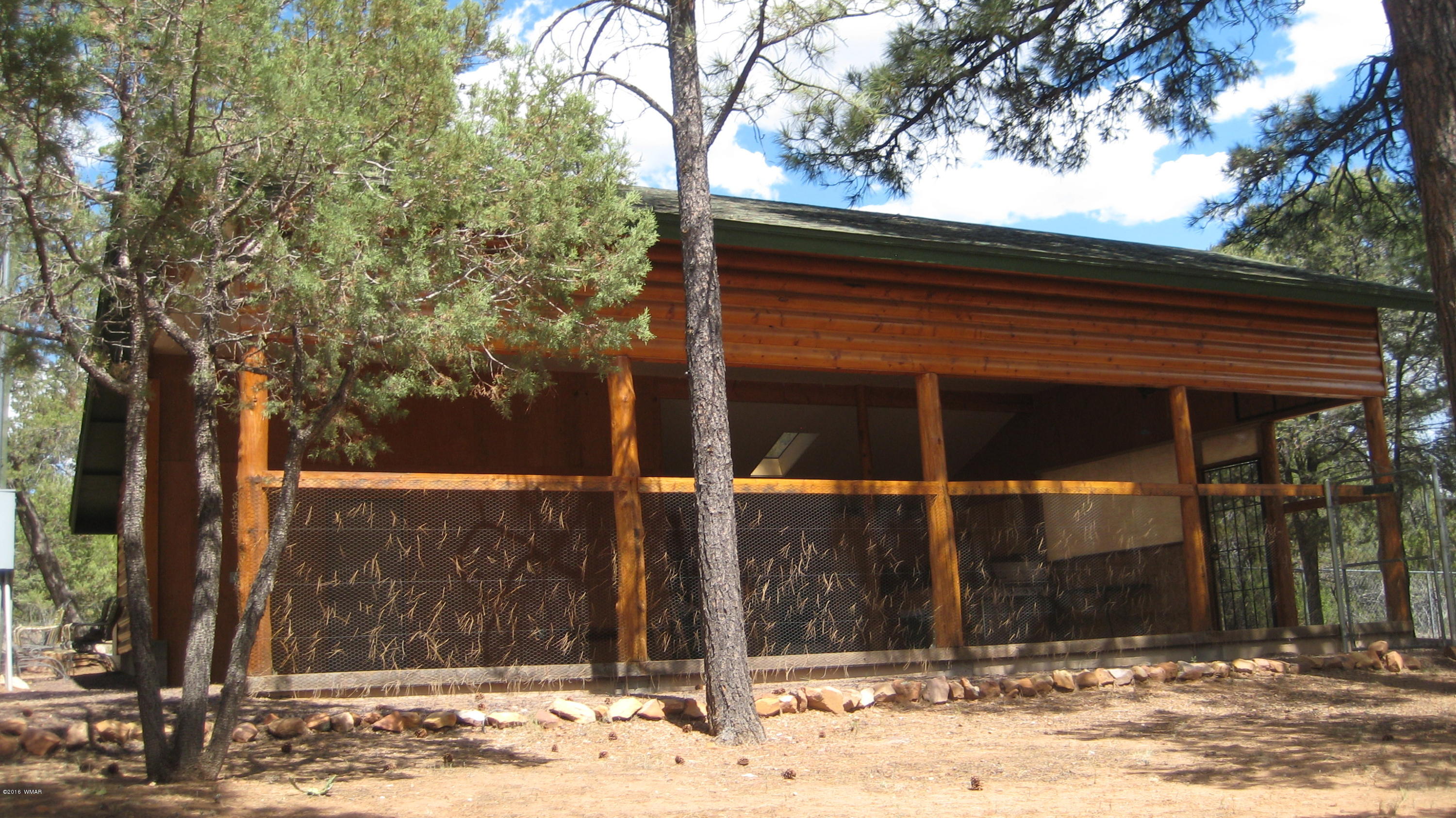 2845 Markham Road Overgaard, AZ 85933 - Photo 54 of 56 a view of a house with a yard and tree