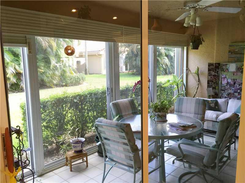 11096 Rios Road, Unit 11096 Boca Raton, FL 33498 - Photo 21 of 35 a view of a dining room with furniture window and outside view