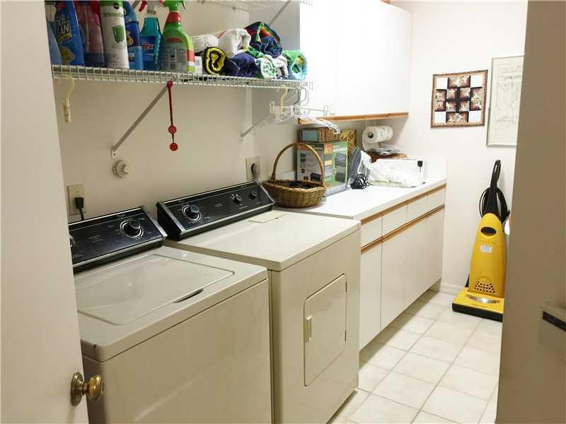 11096 Rios Road, Unit 11096 Boca Raton, FL 33498 - Photo 26 of 35 a utility room with dryer and washer