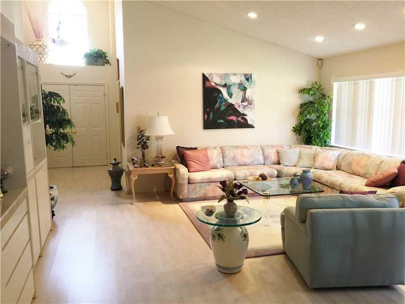 11096 Rios Road, Unit 11096 Boca Raton, FL 33498 - Photo 3 of 35 a living room with furniture a couch and a potted plant