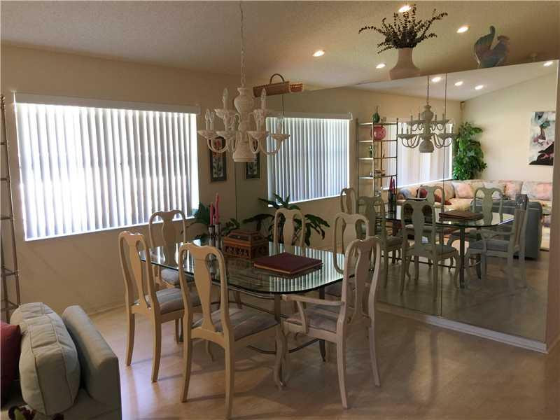 11096 Rios Road, Unit 11096 Boca Raton, FL 33498 - Photo 4 of 35 a dining room with furniture and window