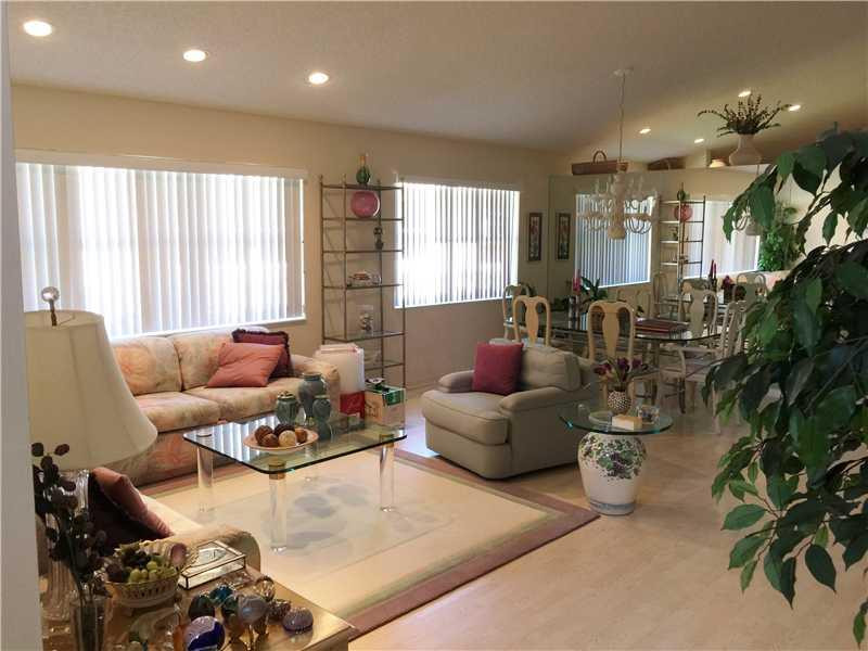 11096 Rios Road, Unit 11096 Boca Raton, FL 33498 - Photo 5 of 35 a living room with furniture and a large window