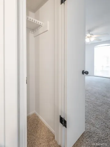a view of a hallway with closet