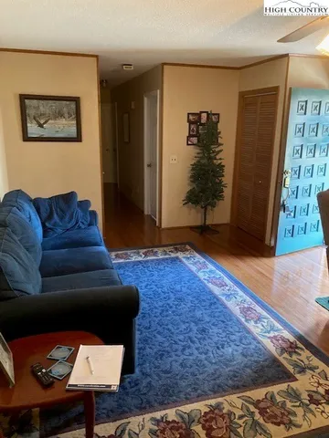 a living room with furniture and a rug