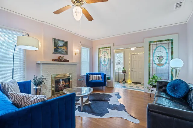 a living room with furniture and a fireplace