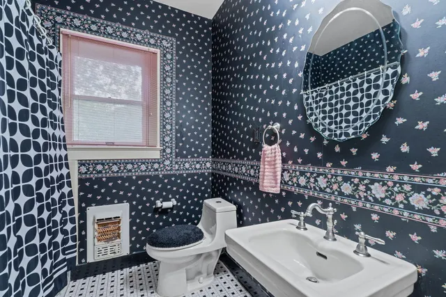 a bedroom with a bed closet and a flat tv screen