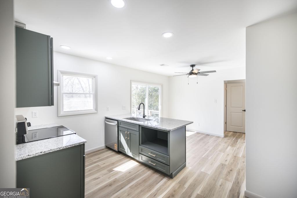 103 Spring Street Warner Robins, GA 31088 - Photo 13 of 30 a view of living room with granite countertop furniture and fireplace