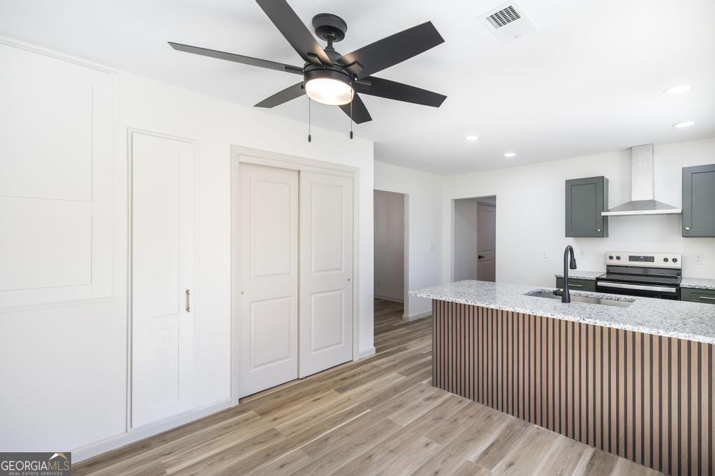 103 Spring Street Warner Robins, GA 31088 - Photo 16 of 30 a kitchen with stainless steel appliances granite countertop a refrigerator a sink and a stove
