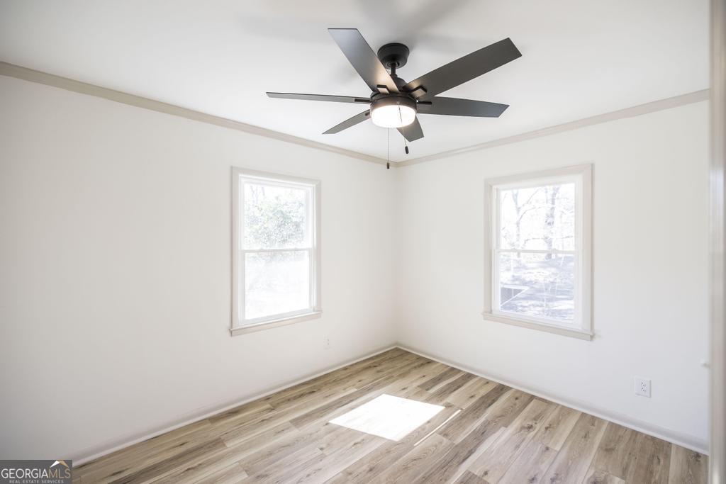 103 Spring Street Warner Robins, GA 31088 - Photo 20 of 30 a view of an empty room and wooden floor