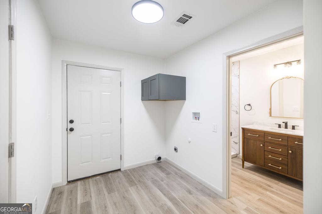 103 Spring Street Warner Robins, GA 31088 - Photo 22 of 30 a view of bathroom with a sink mirror and window