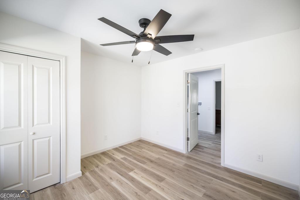 103 Spring Street Warner Robins, GA 31088 - Photo 25 of 30 a view of empty room with wooden floor