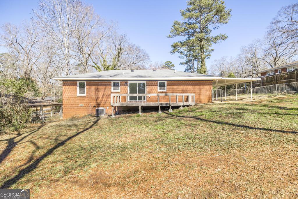 103 Spring Street Warner Robins, GA 31088 - Photo 28 of 30 front view of a house with a yard
