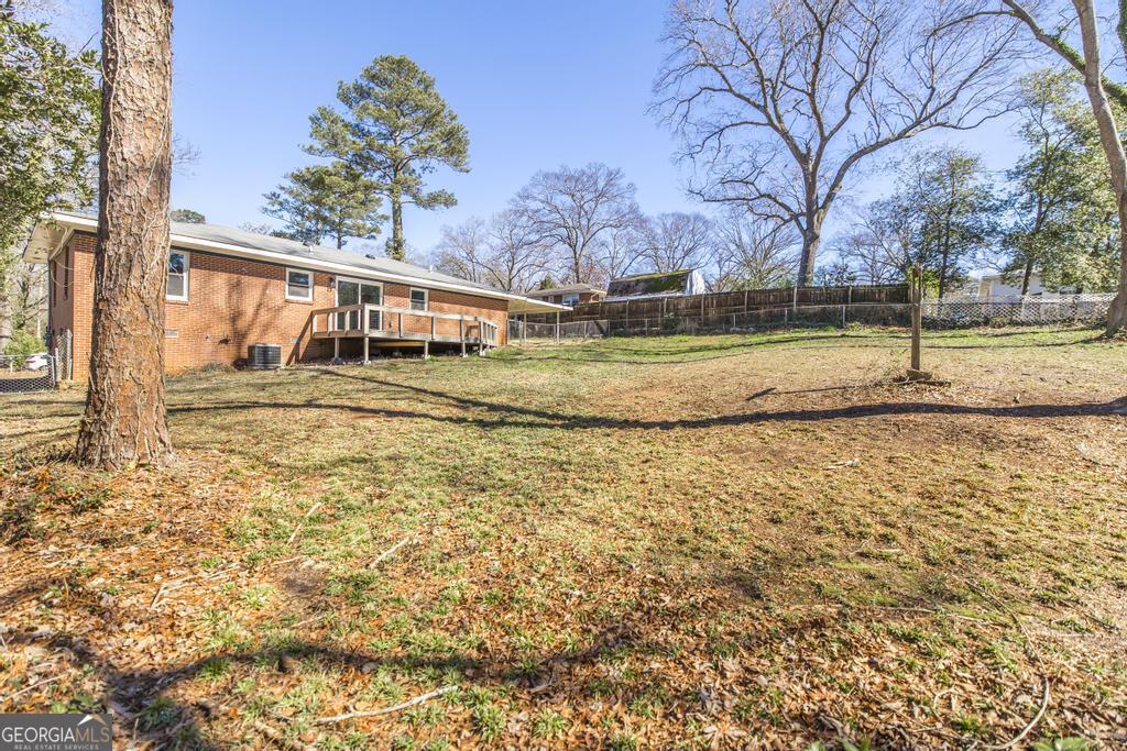 103 Spring Street Warner Robins, GA 31088 - Photo 29 of 30 a view of a yard with a house