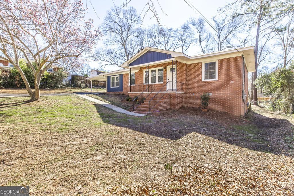 103 Spring Street Warner Robins, GA 31088 - Photo 4 of 30 a view of a yard in front of a house