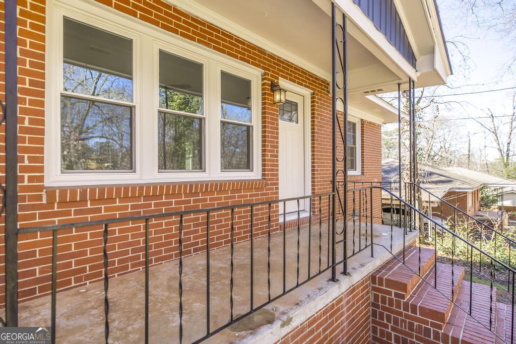 103 Spring Street Warner Robins, GA 31088 - Photo 7 of 30 a view of a brick house with a large window