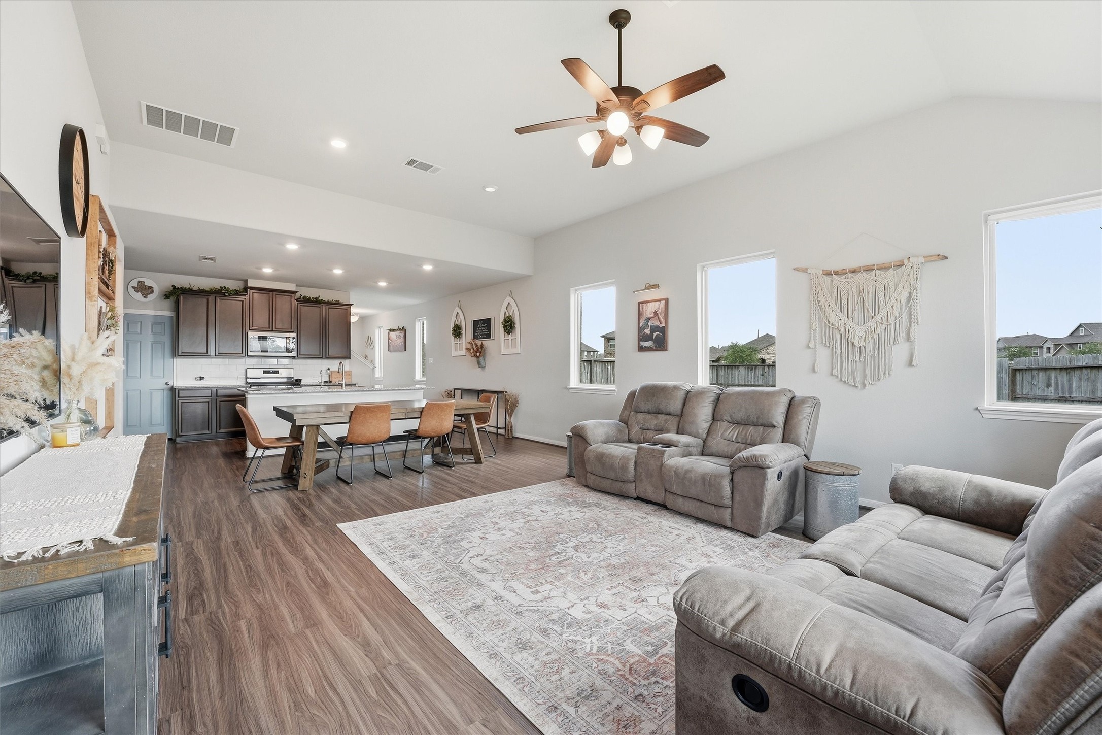 2130 Shellbark Way La Marque, TX 77568 - Photo 9 of 30 The living room is cozy with plush seating and natural light from large windows. The neutral tones a create a warm, inviting atmosphere.