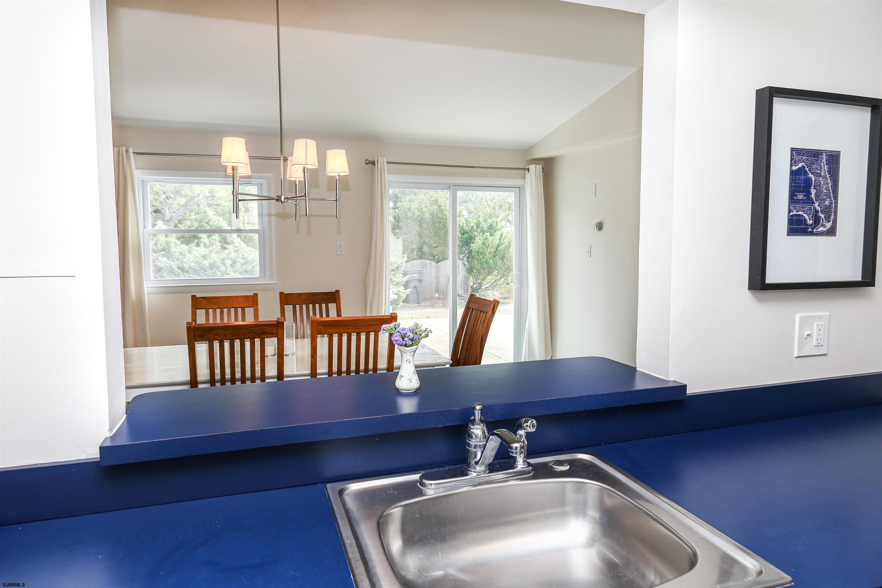 307 28th Street South Brigantine, NJ 08203 - Photo 12 of 38 a kitchen with a sink a window and wooden floor