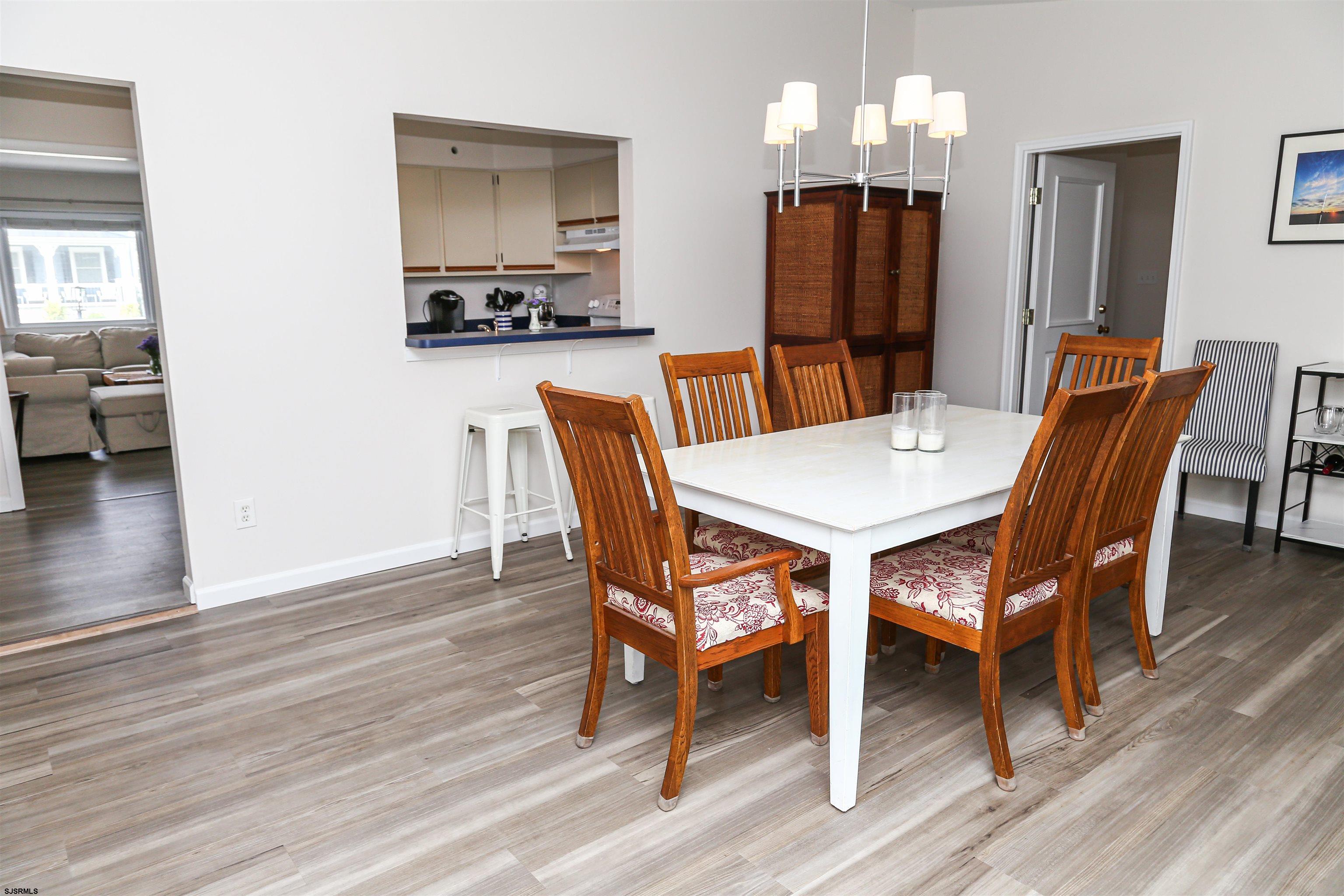 307 28th Street South Brigantine, NJ 08203 - Photo 13 of 38 a view of a dining room with furniture and wooden floor