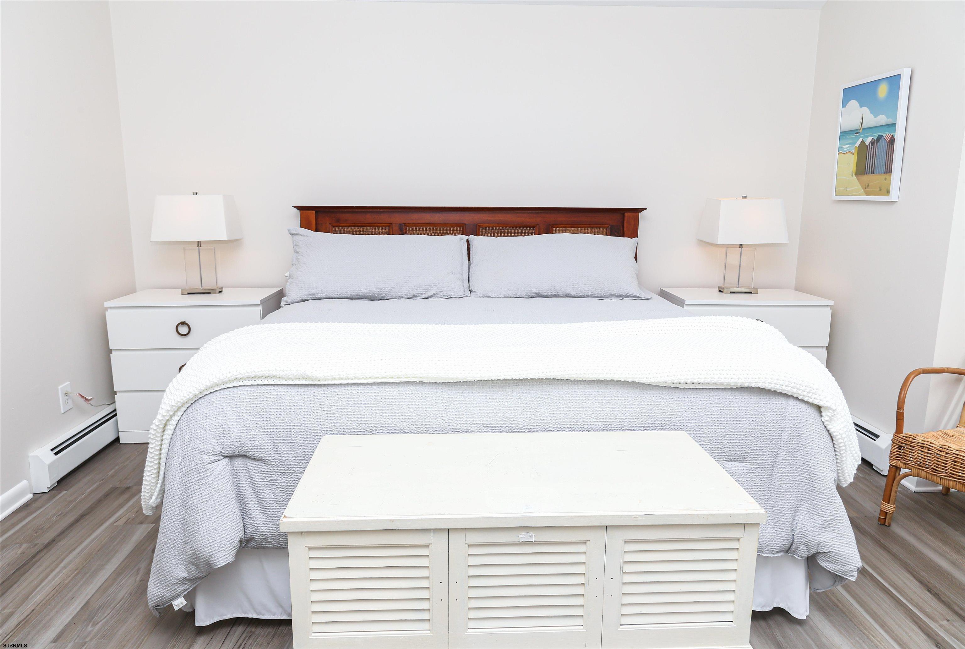 307 28th Street South Brigantine, NJ 08203 - Photo 16 of 38 a bedroom with a bed and a night stand