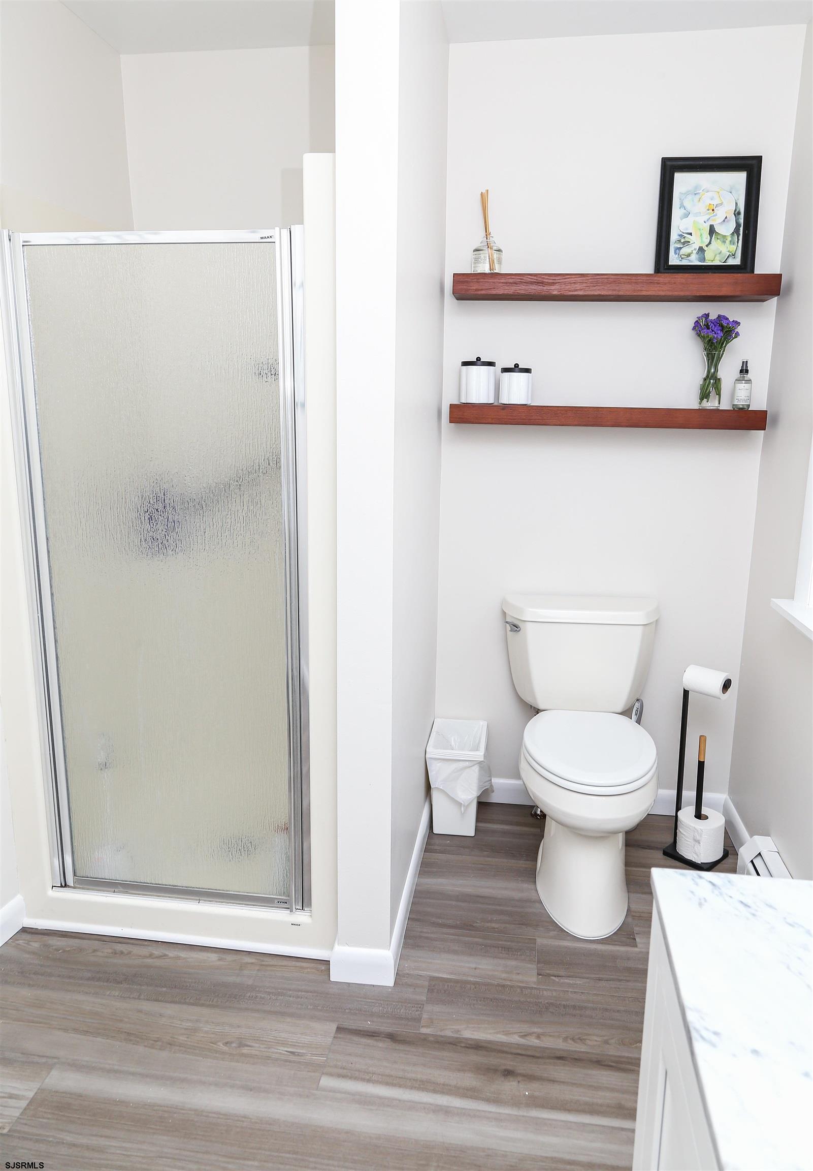 307 28th Street South Brigantine, NJ 08203 - Photo 20 of 38 a white toilet sitting next to a bathroom sink