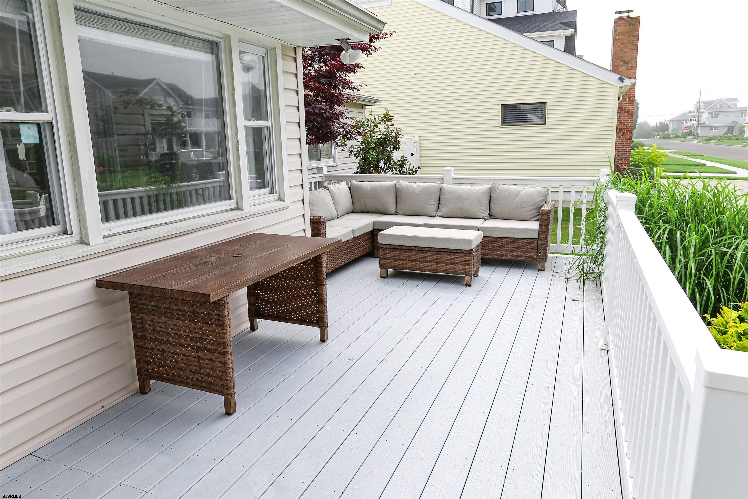 307 28th Street South Brigantine, NJ 08203 - Photo 2 of 38 a balcony with furniture and wooden floor