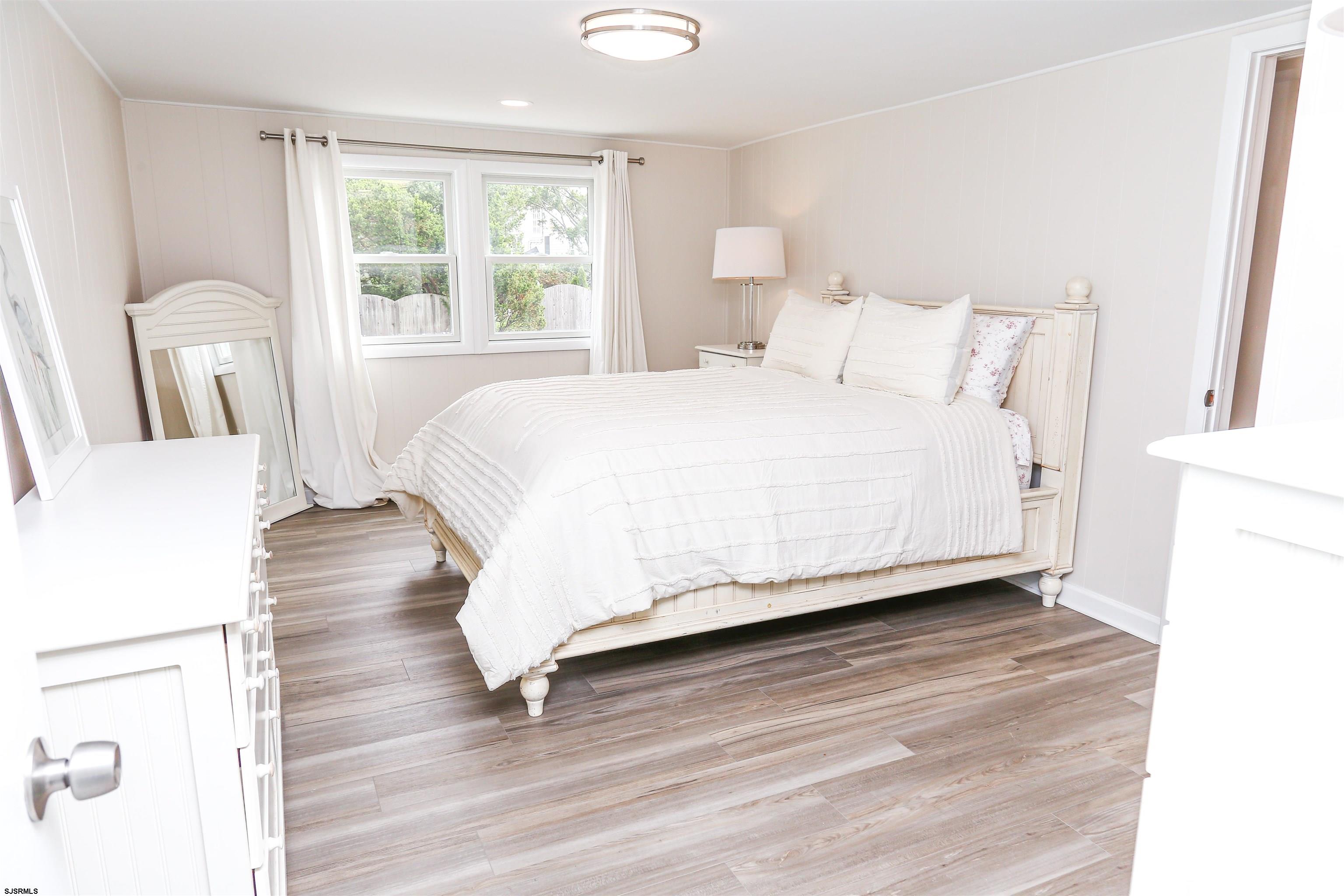 307 28th Street South Brigantine, NJ 08203 - Photo 21 of 38 a large white bed in a white room