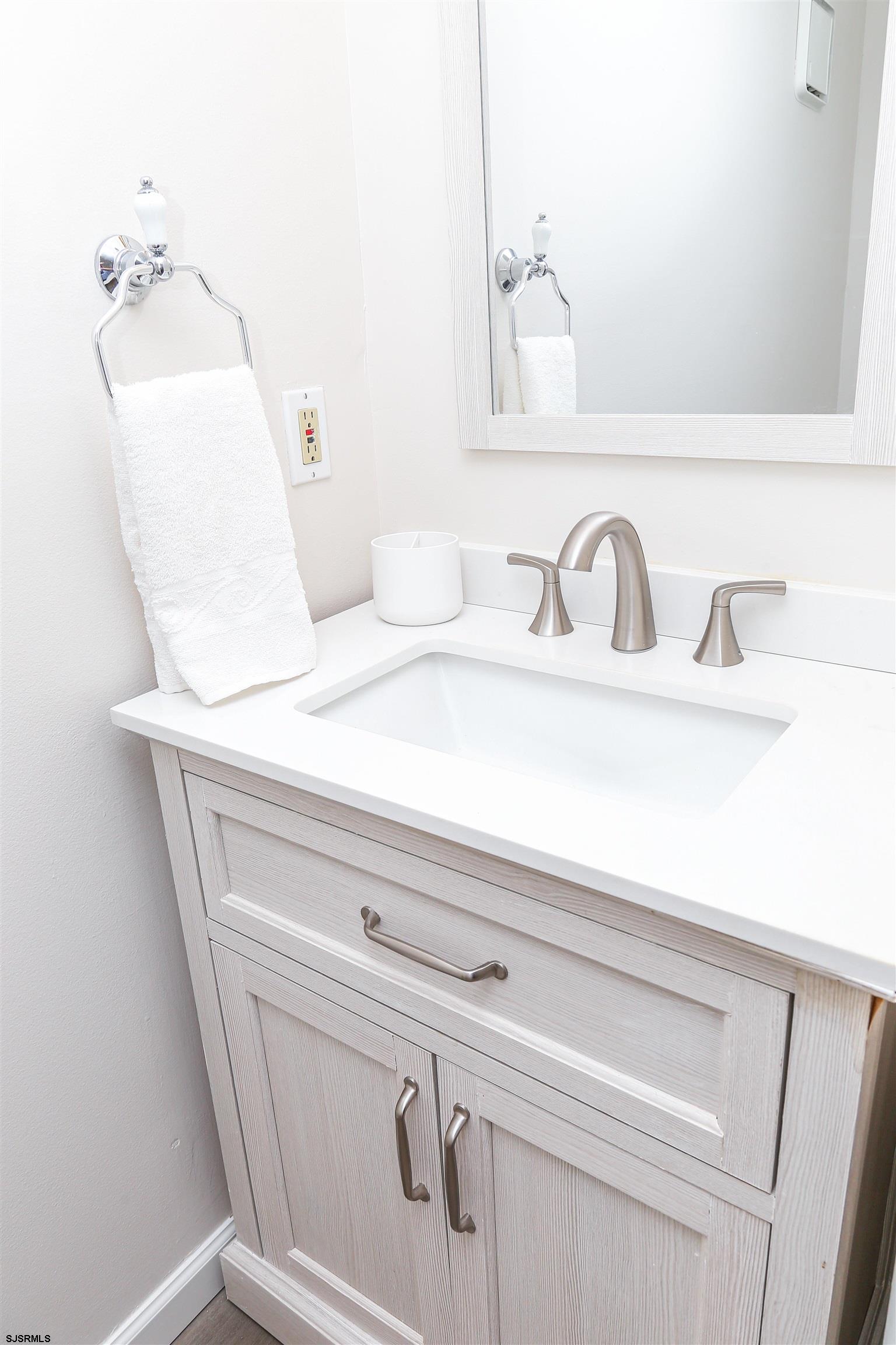 307 28th Street South Brigantine, NJ 08203 - Photo 24 of 38 a close view of sink and tap