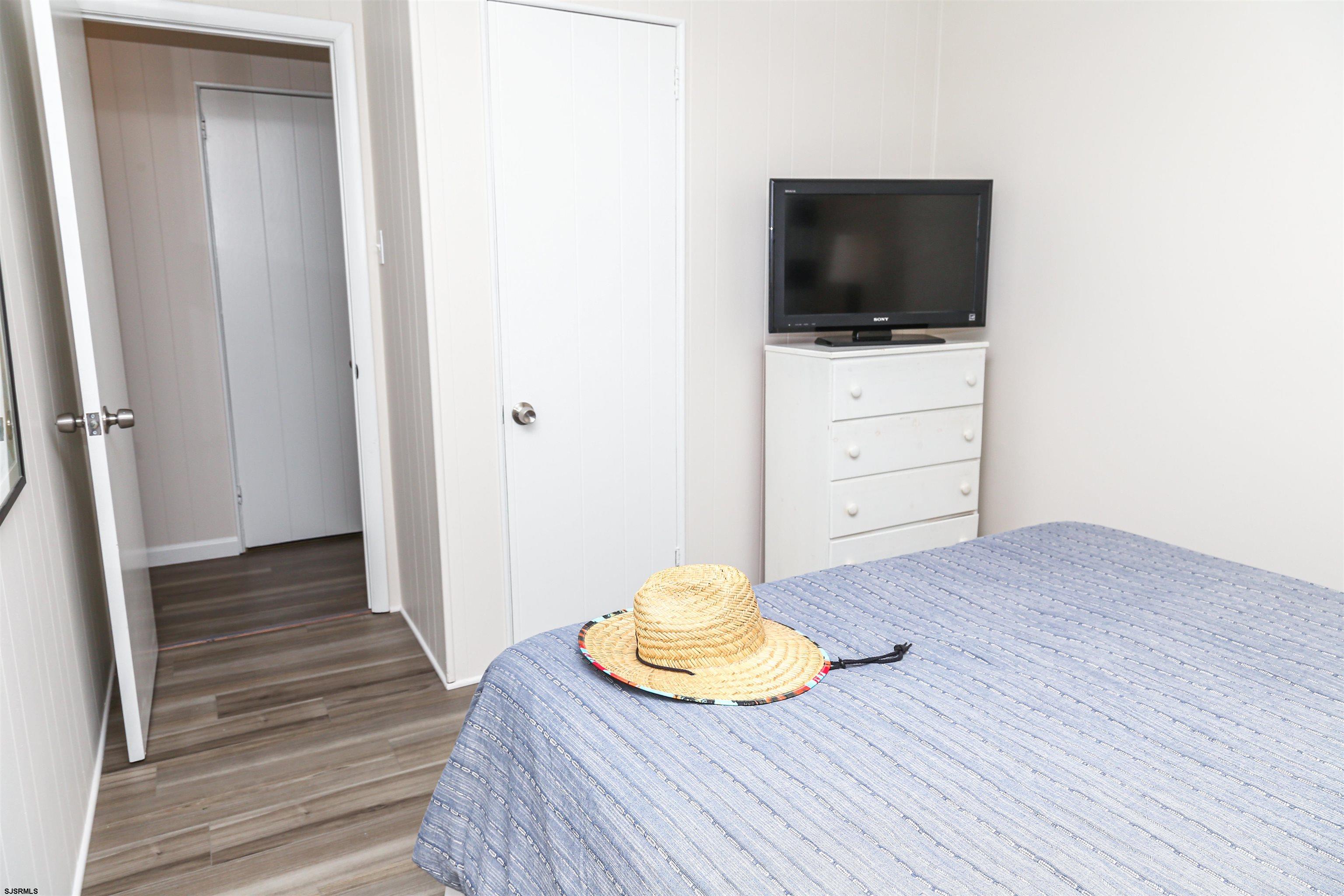 307 28th Street South Brigantine, NJ 08203 - Photo 27 of 38 wooden floor in an empty room