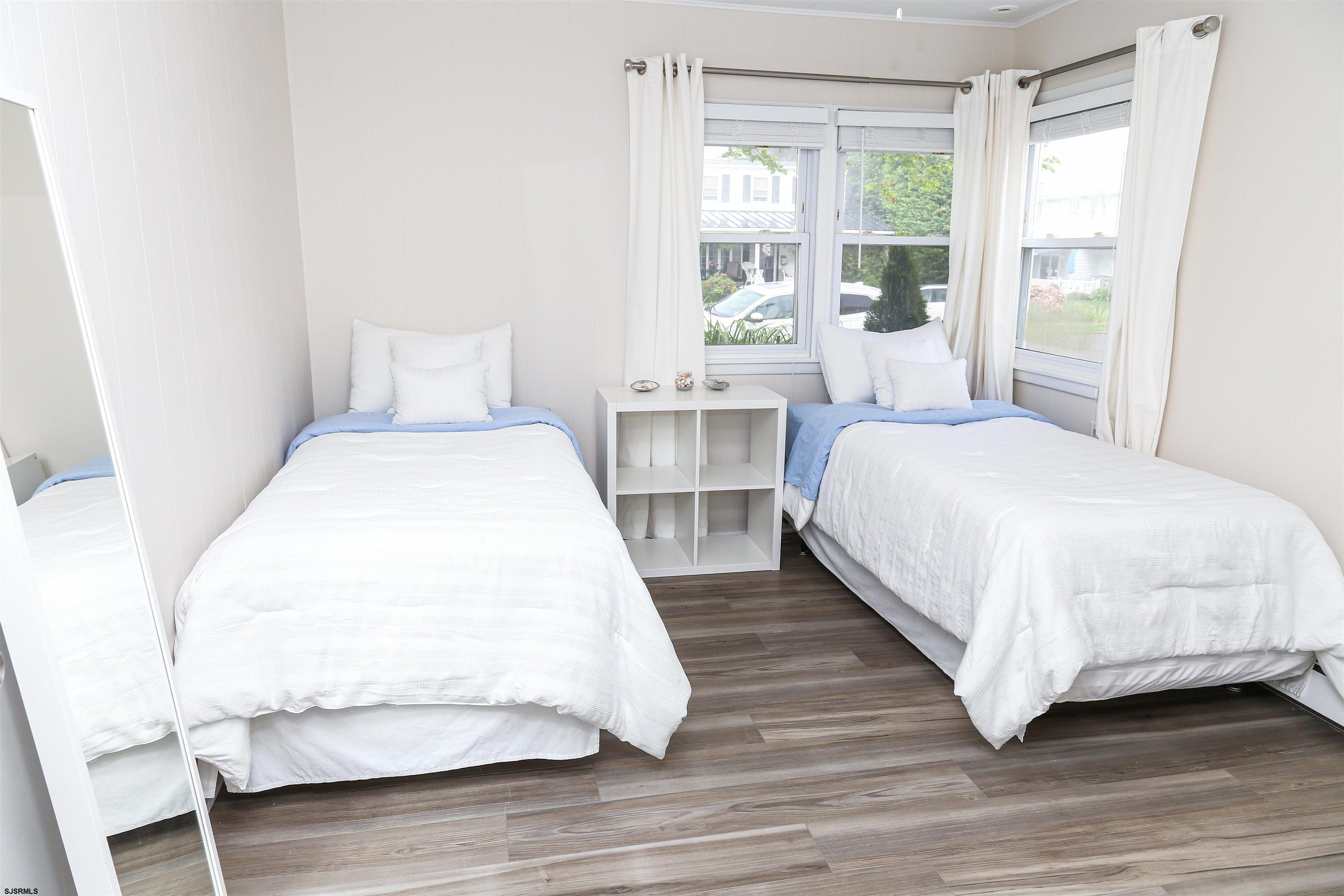 307 28th Street South Brigantine, NJ 08203 - Photo 29 of 38 a bedroom with a bed and a large window