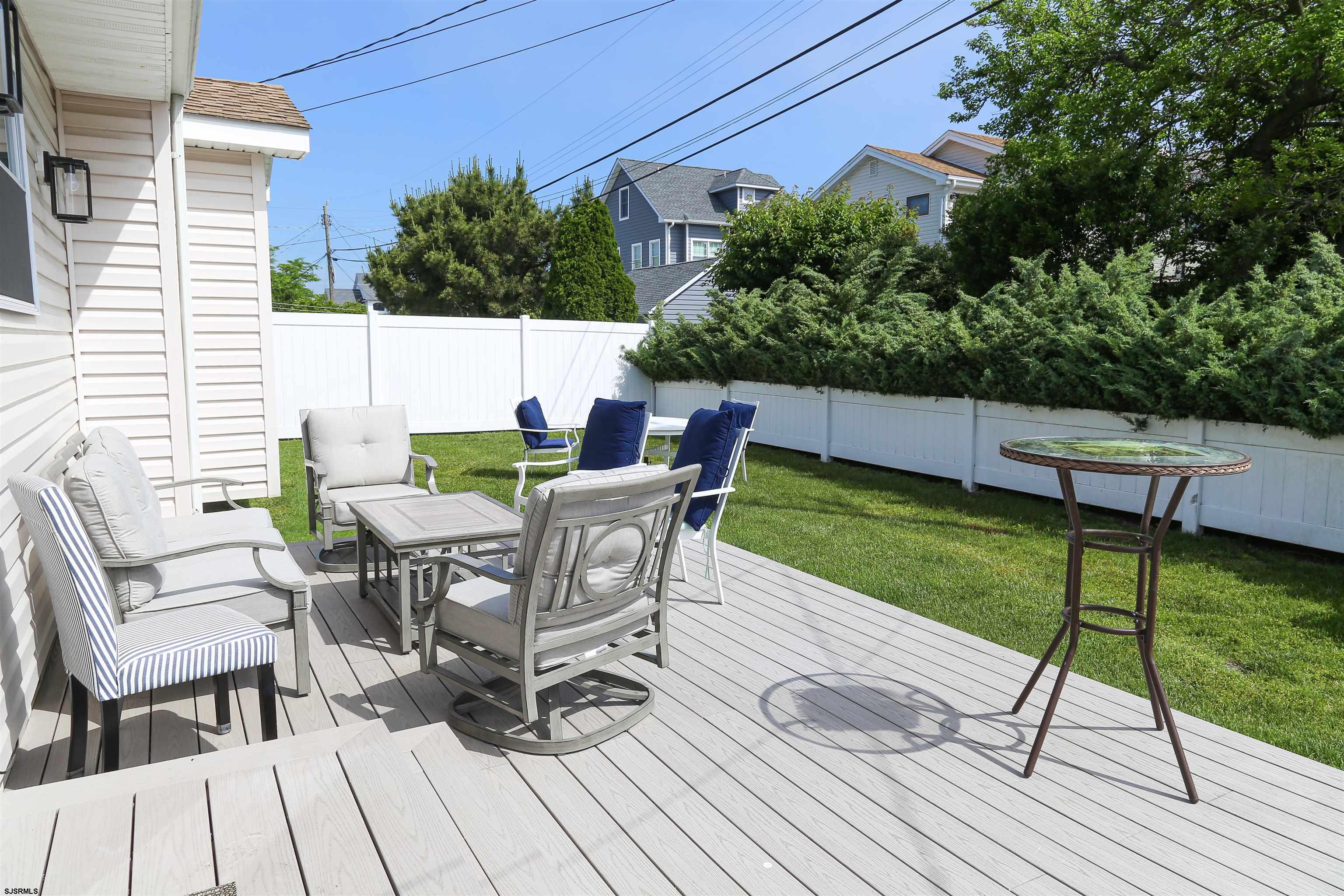 307 28th Street South Brigantine, NJ 08203 - Photo 5 of 38 a view of a chairs and table on the deck