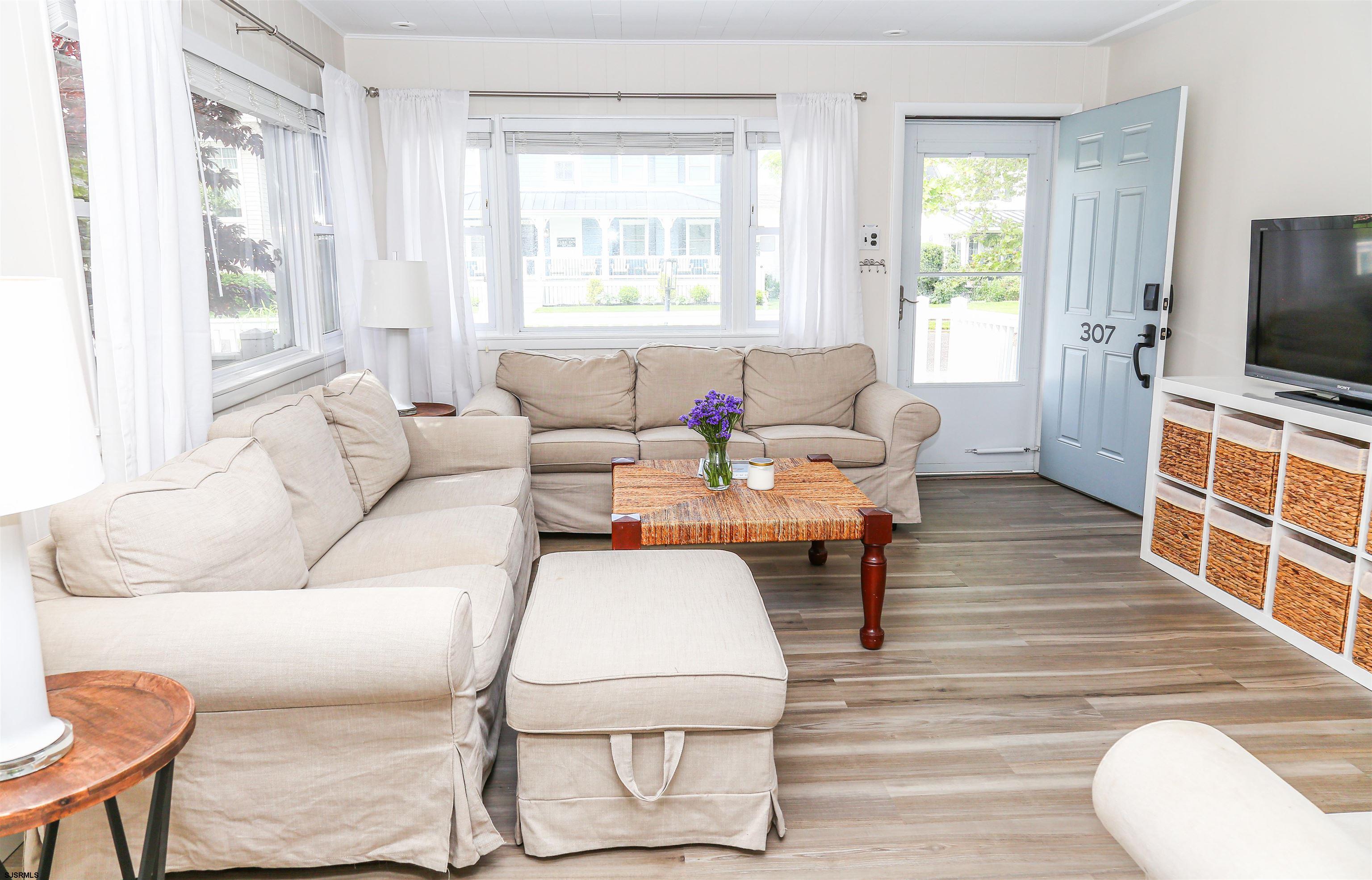 307 28th Street South Brigantine, NJ 08203 - Photo 7 of 38 a living room with furniture and a flat screen tv
