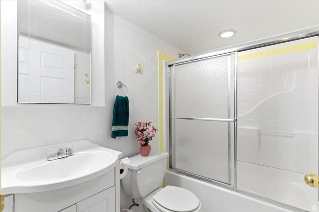 72 Canal Bank Road Garland, UT 84312 - Photo 25 of 40 Bathroom featuring a white vanity with integrated sink, chrome faucet, and a wall-mounted medicine cabinet