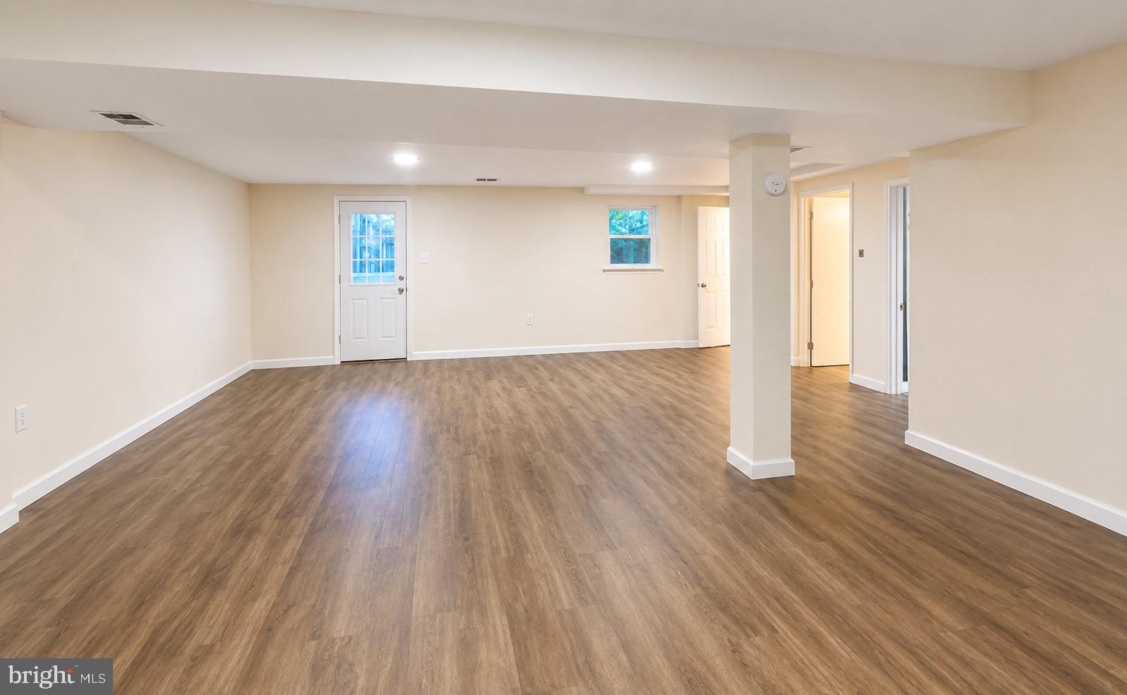 11312 Old Fort Road Fort Washington, MD 20744 - Photo 10 of 13 an empty room with wooden floor and windows