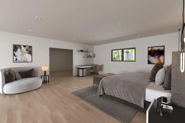 a bedroom with bed and a couch