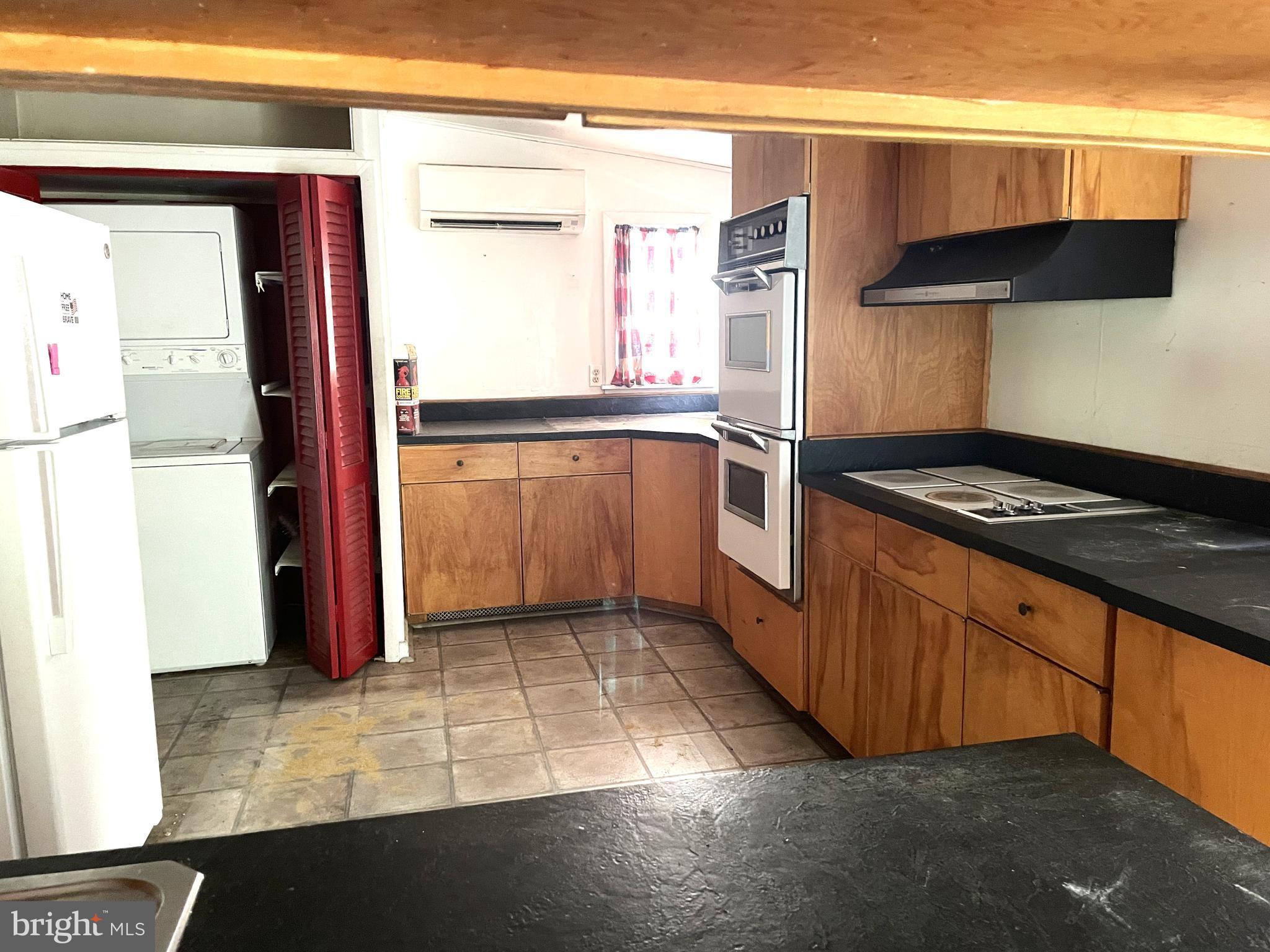 16 Brice Road Annapolis, MD 21409 - Photo 14 of 26 a kitchen with a refrigerator a stove and a microwave