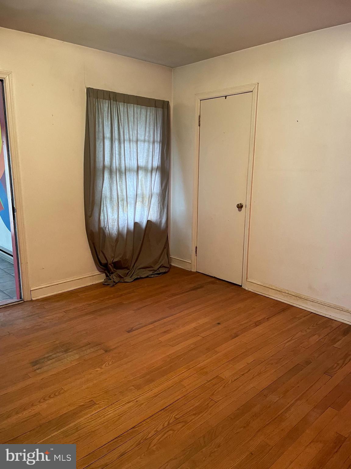 16 Brice Road Annapolis, MD 21409 - Photo 17 of 26 an empty room with wooden floor and windows