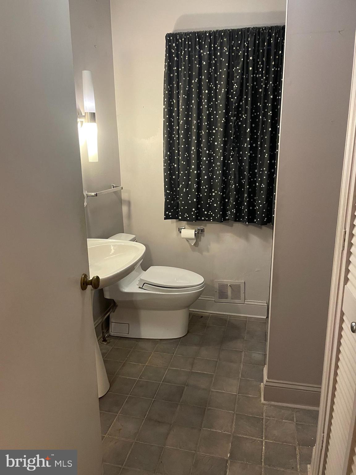 16 Brice Road Annapolis, MD 21409 - Photo 18 of 26 a bathroom with a toilet a sink and a shower