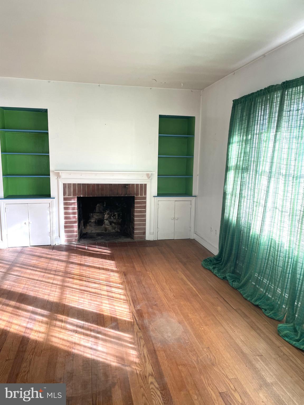 16 Brice Road Annapolis, MD 21409 - Photo 5 of 26 a view of empty room with window and fireplace