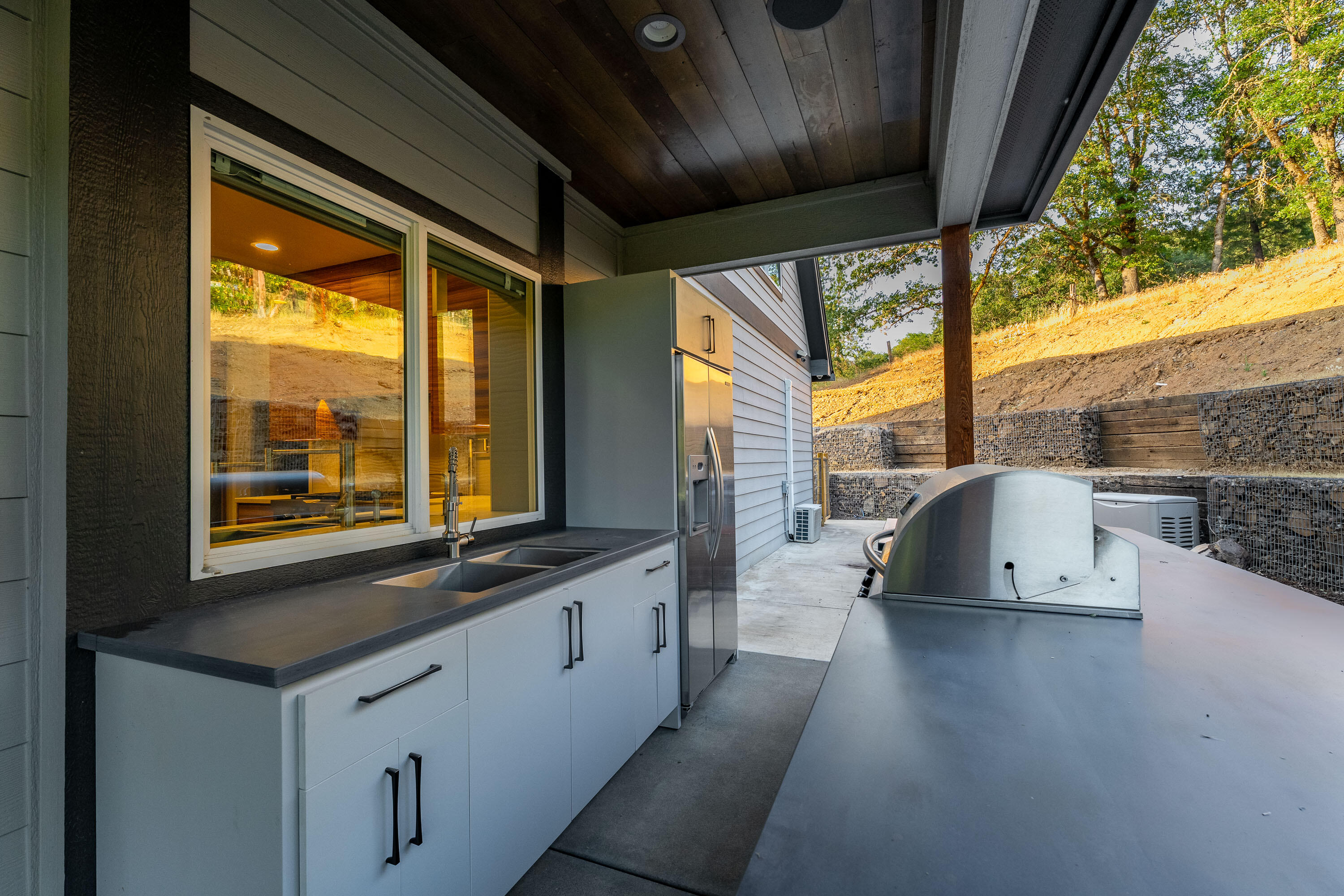 182 Wards Creek Road Rogue River, OR 97537 - Photo 62 of 80 a kitchen with stainless steel appliances granite countertop a sink a stove and a wooden floors