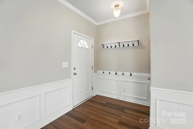 a view of an empty room and wooden floor