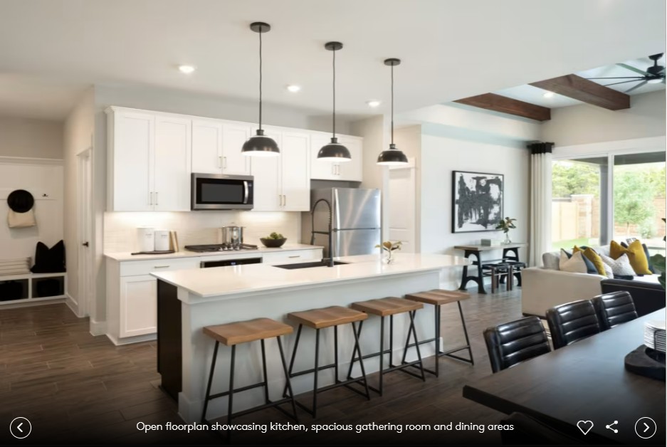 424 Foresail Road Leander, TX 78641 - Photo 5 of 7 a open kitchen with stainless steel appliances kitchen island granite countertop a stove a sink a dining table and chairs with wooden floor