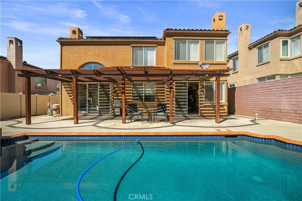 1147 Rosemary Circle Corona, CA 92879 - Photo 29 of 32 a front view of a house with a yard