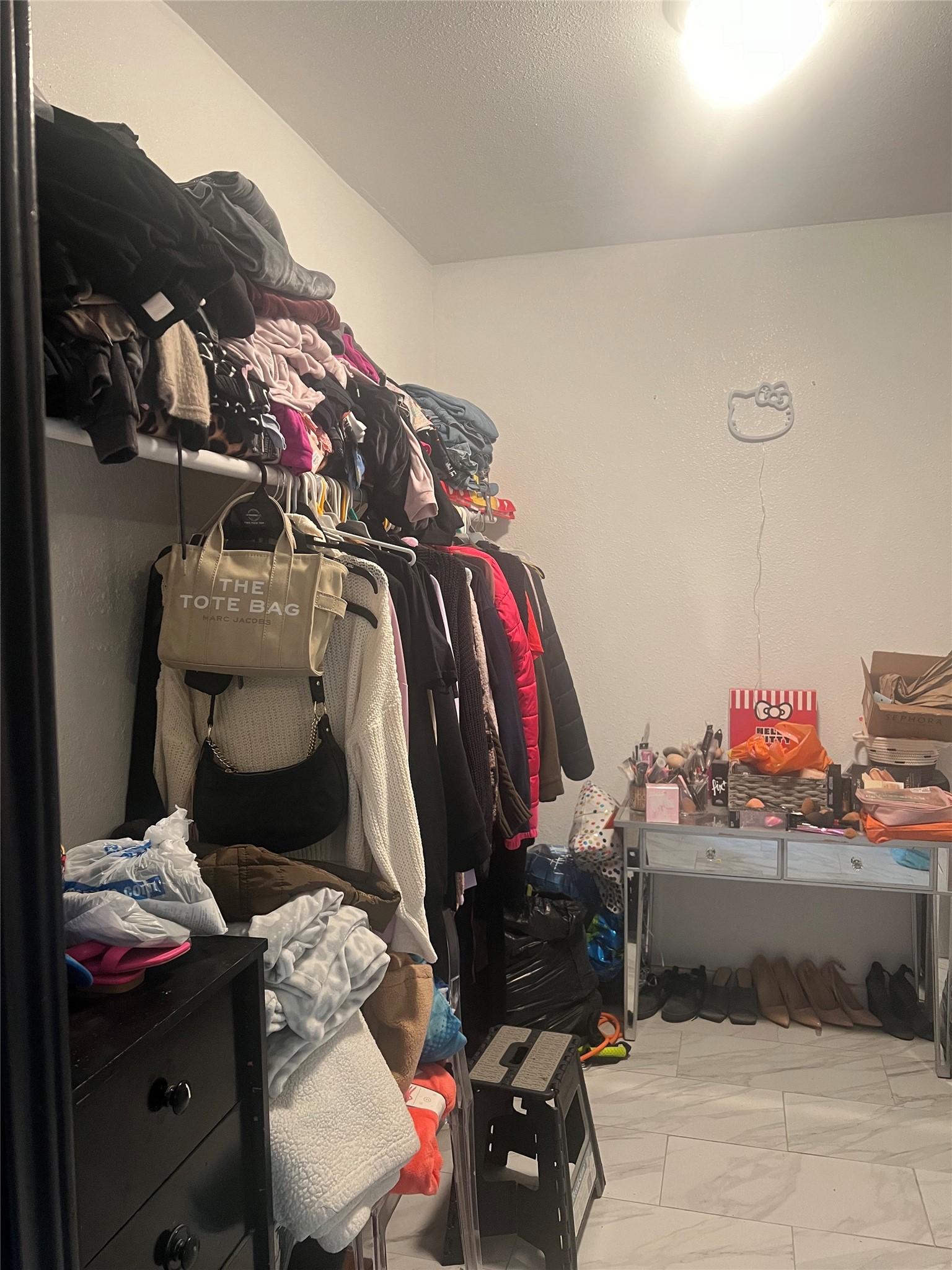 22360 East Martin Drive Porter, TX 77365 - Photo 7 of 10 a view of walk in closet with clothes and shoes