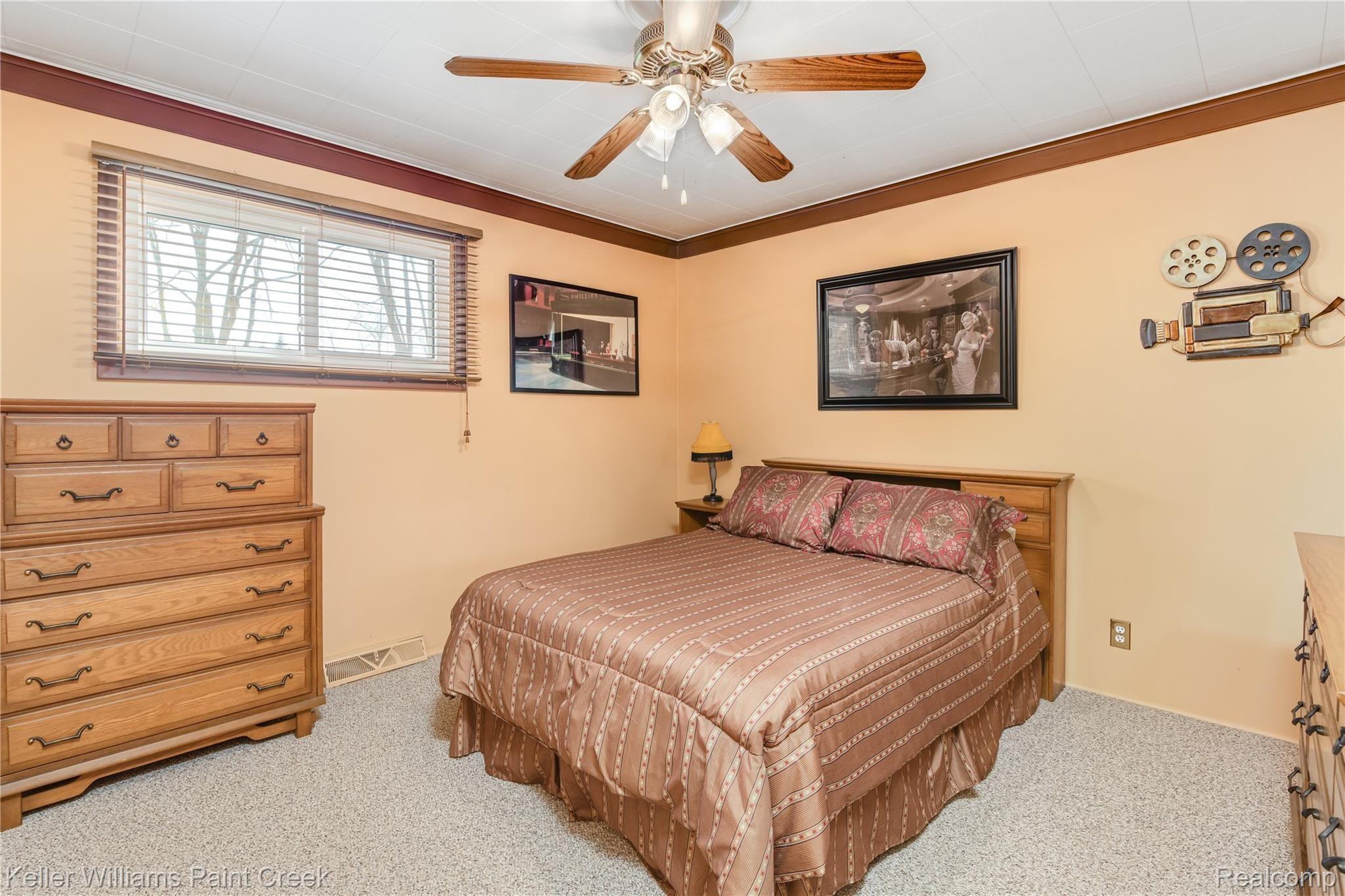 4770 Whipple Lake Road Clarkston, MI 48348 - Photo 7 of 21 Additional spacious bedroom offers generous closet space and tons of furniture options.