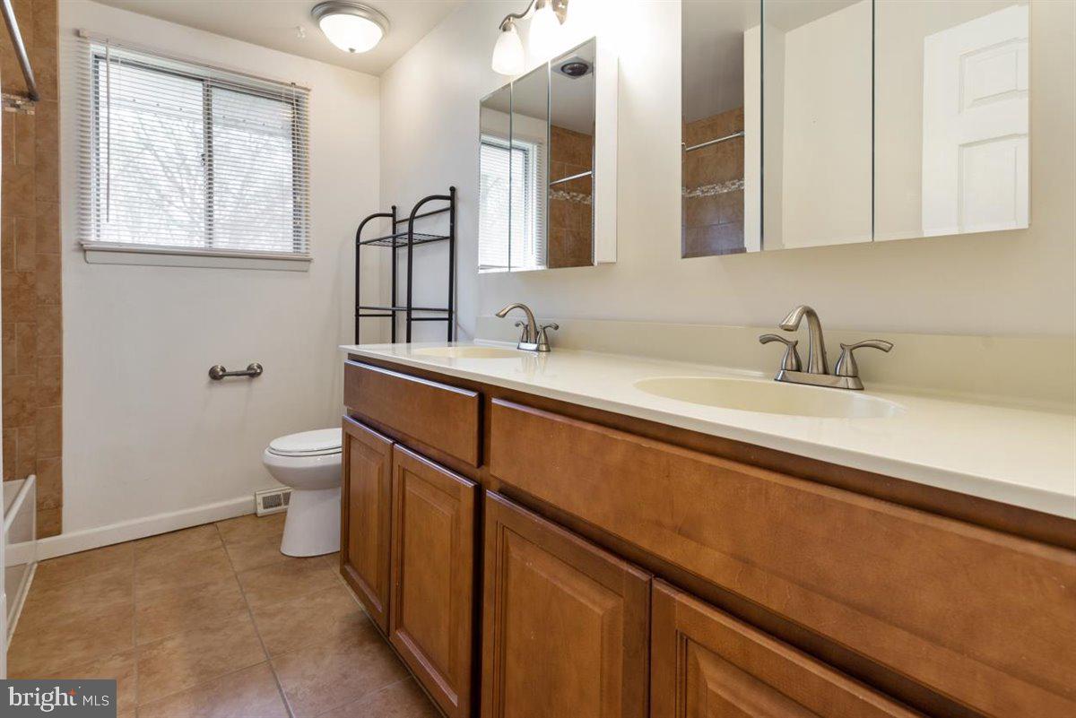 3605 Templar Road Randallstown, MD 21133 - Photo 27 of 39 Hall bath with dual vanity & tile tub surround
