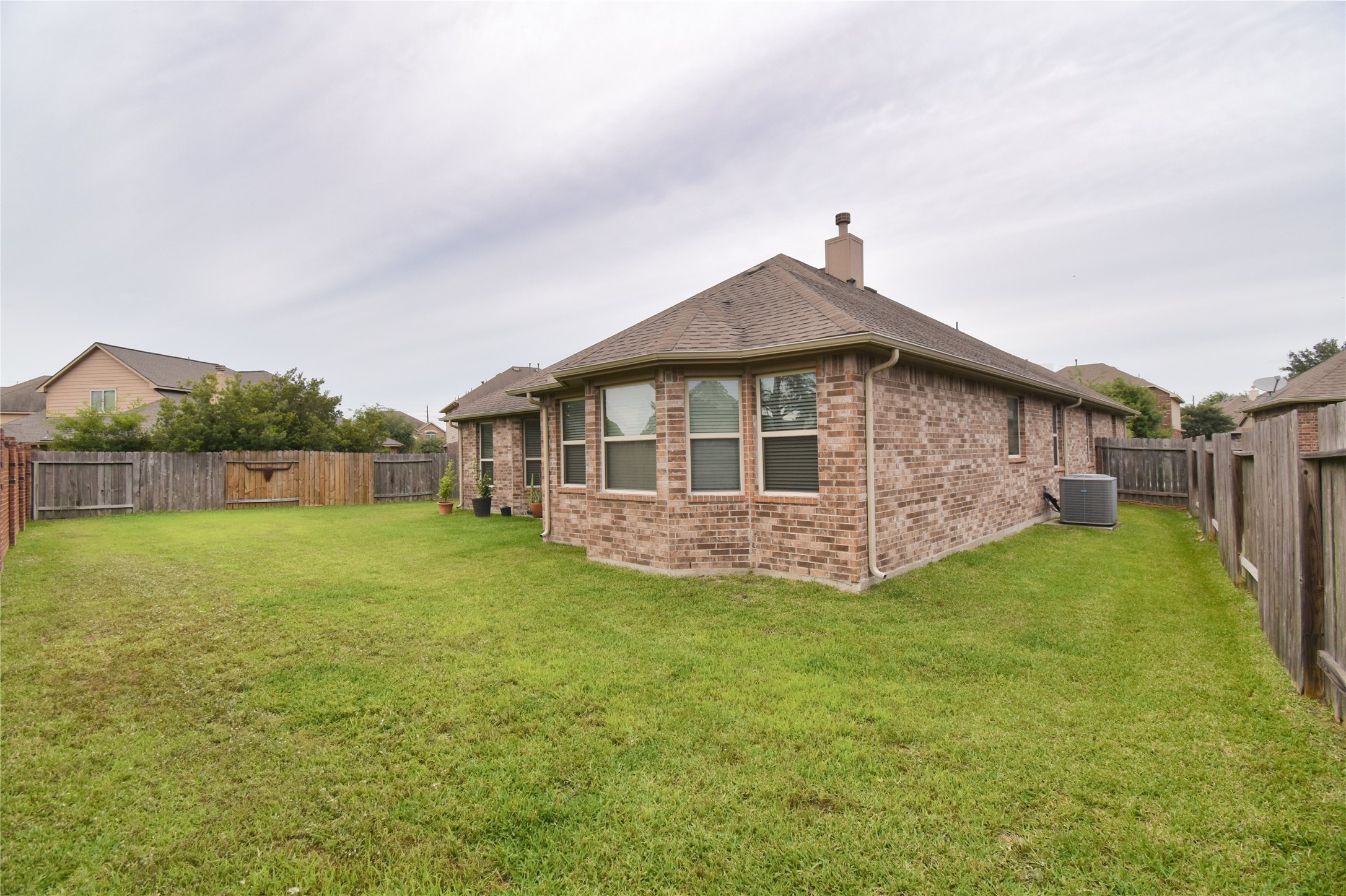 5607 South Denham Ridge Lane Spring, TX 77389 - Photo 38 of 39 a view of a house with a yard