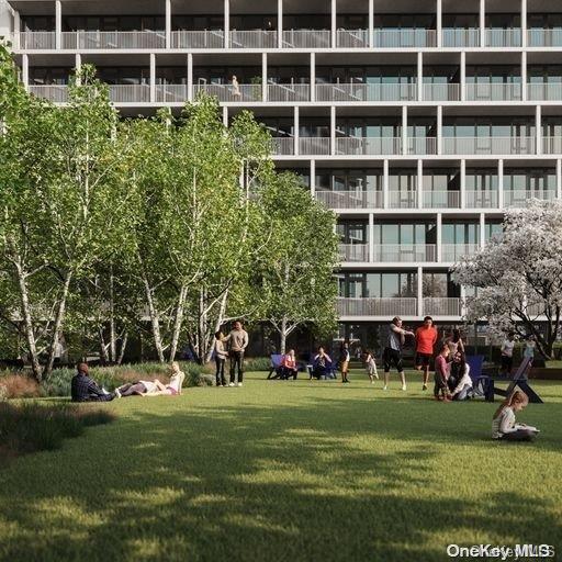 131-02 40th Road, Unit 5G Queens, NY 11354 - Photo 9 of 32 a view of a building with a yard