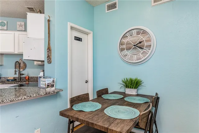 a view of a dining area with furniture and wooden floor